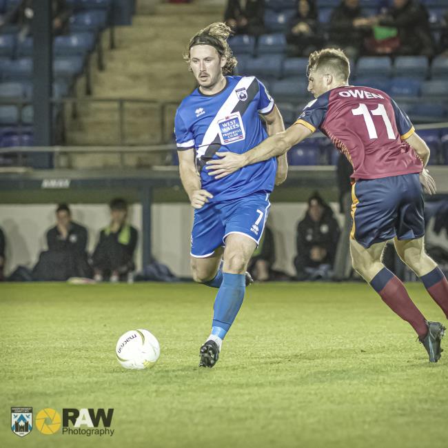 Ricky Watts glides past goal scorer Harry Owen
